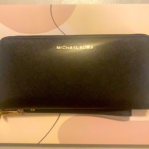 Large black leather MK wallet with wristlet attachment